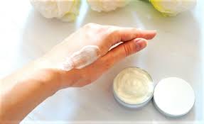 non greasy hand balm image of someone with the balm on top of their hand  