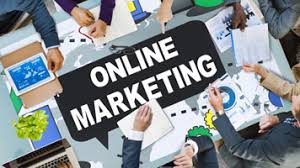 e-business and e-marketing image of a banner with the words online marketing with people around  table