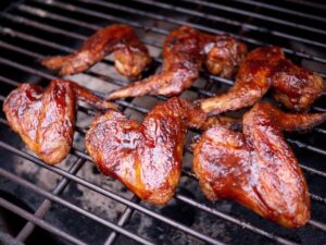 barbeque sauce some delicious looking wings smothers with bbq sauce on the grill