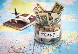 travel at a discount image of a jar full of money and a play plane on top of a notebook