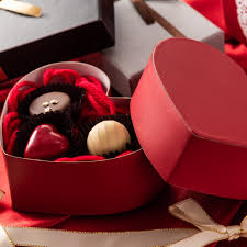 valentines day picture of an open heart shaped box with chocolates