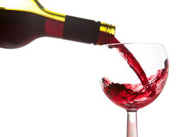 entertainment gift ideas image of a goblet being filled with red wine